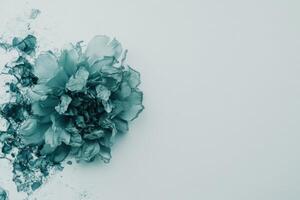 Abstract teal flower with ink wash effect photo