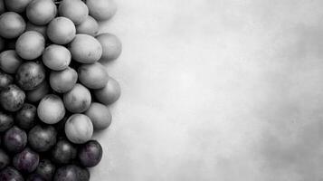 Monochrome grapes on grey background photo