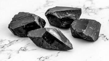Rough black tourmaline mineral stones photo