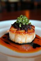 Close Up of a Scallop Dish with Savory Sauce Drizzle photo