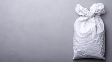 Simple white sack, flat lay on gray surface photo