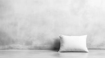 Minimalist White Pillow Against a Textured Concrete Wall photo