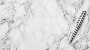 Silver Pen on Marble Surface photo