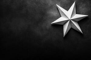 Monochrome Paper Star Origami on Dark Textured Surface photo