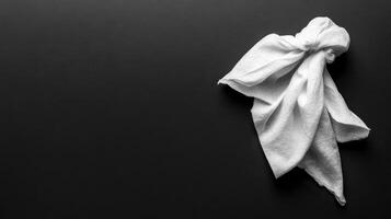 Minimalist Composition White Cloth on Deep Black Backdrop photo