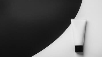 White Cosmetic Tube with Black Cap on Contrasting Background photo