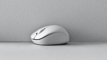 Simple white wireless mouse on a neutral surface, computer accessory photo
