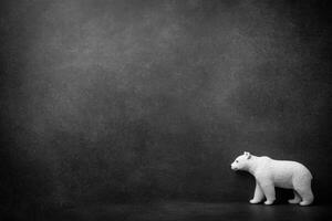 Polar Bear Toy Animal Isolated on Black Surface Minimalist photo