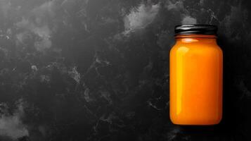 Golden Honey Pot Rests Against Textured Backdrop photo