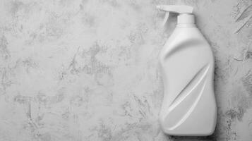 Monochrome Studio Shot of White Plastic Spray Bottle on Textured Surface photo