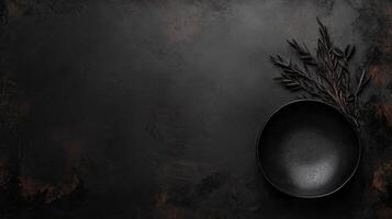 Minimalist Black Bowl and Rosemary Sprig on Rustic Background photo