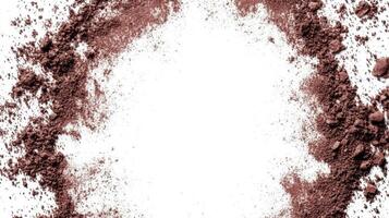 Scattered Brown Pigment Frame on White Surface photo