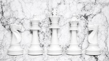 White chess pieces are lined up against a marble background photo