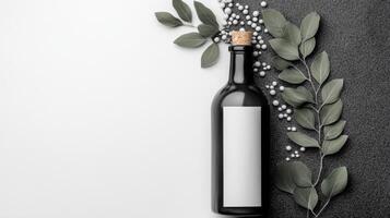 An elegant bottle with a white label in a minimalistic composition on the background photo