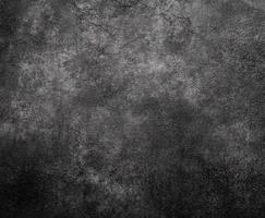 Dark textured surface with subtle variation in tone and shade photo