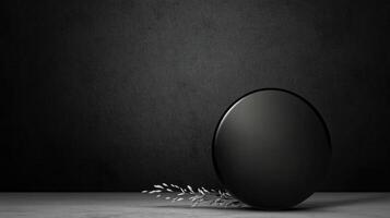 Glass Sphere and Delicate Sprig on Dark Textured Surface photo