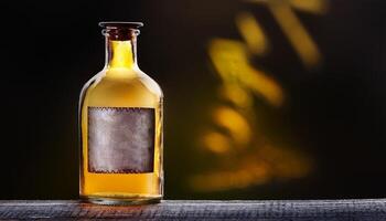 Vintage Glass Bottle Filled With Amber Liquid Displayed Against a Dark Background With Shadows photo