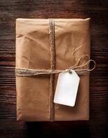 Gift Wrapped Package Tied With Twine Resting on a Wooden Table in Soft Lighting photo