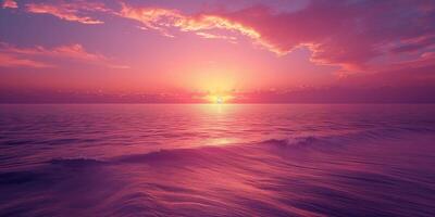 A tranquil sunset over the ocean, with vibrant pink and purple hues reflecting on calm waters. photo