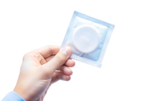 Hand holding a condom in its original packaging against a black background png