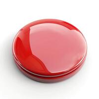 A glossy, round red button resting on a clean, reflective surface. photo