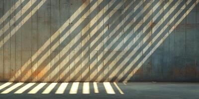 A textured concrete wall illuminated by dramatic shadows, creating a striking visual of light and pattern. photo