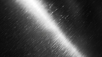 Close-up of a sleek, brushed metallic surface with subtle light reflections creating an elegant, modern aesthetic. photo
