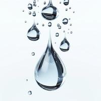 Close-up of crystal-clear water droplets suspended in mid-air, showcasing their reflective surfaces. photo