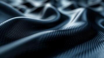 Texture of dark blue fabric with a honeycomb pattern, creating a visually striking and modern look. photo