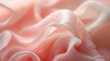 Soft, wrinkled fabric drapes elegantly in gentle hues of pale pink, creating an inviting and serene atmosphere. photo