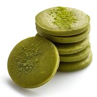 A stack of soft, vibrant green matcha pancakes, highlighting their fluffy texture and rich color, perfect for breakfast. photo