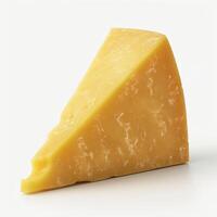 A vibrant yellow wedge of aged cheese against a clean, light background. photo