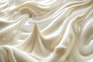 Close-up of creamy, swirled texture resembling luxurious frosting or thick cream. photo