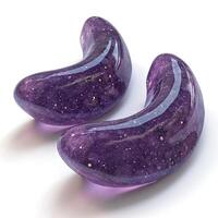Two glossy, purple, galactic-inspired objects with a cosmic texture, resembling polished stones. photo