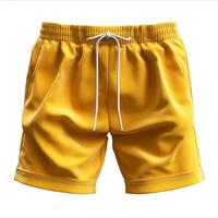 Bright yellow men's swim shorts with an elastic waistband and drawstring for a comfortable fit. photo