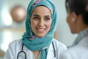 A confident Middle-Eastern female doctor in a hijab smiles warmly while conversing with a patient. photo