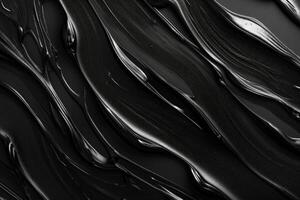 A close-up view of flowing black paint, showcasing a glossy texture and elegant movement. photo