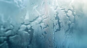 Abstract close-up of condensation on glass with a cool blue hue, creating a tranquil and serene atmosphere. photo