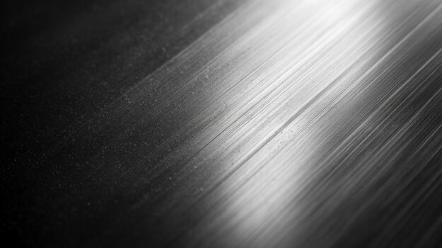 Close-up of a brushed metal surface showcasing dynamic light reflections and textures. photo