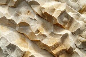 Close-up view of textured stone surface, showcasing intricate patterns and natural earthy tones. photo
