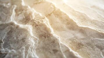 Close-up of a textured, light-colored marble surface with intricate veins and patterns. photo