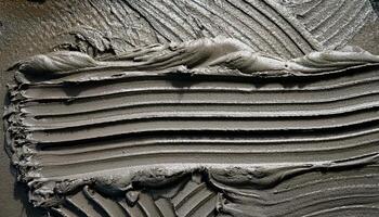 Textured Gray Surface Created by Applying Mortar in Precise, Even Strokes During a Construction Project photo