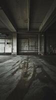 An empty, dark, empty room with a large window photo