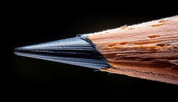 Close-up View of a Sharpened Pencil Tip Highlighting Wood Texture and Graphite photo