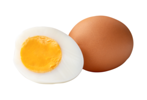 A raw brown chicken eggs and cooked or boiled chicken egg with egg yolk in half in heap isolated with clipping path in file format png