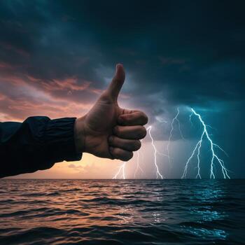 Thumb up with lightning in the background photo