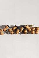Champagne Corks Arranged In A Row. photo