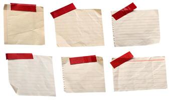 A set of papers, notes, or memos with a red ribbon on a white background photo