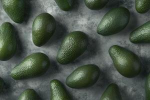 Arrangement of Whole Green Avocados on Textured Gray Background Overhead View photo