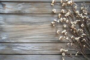 Dry Flower Arrangement on Rustic Wooden Board Creating a Textured Background photo
